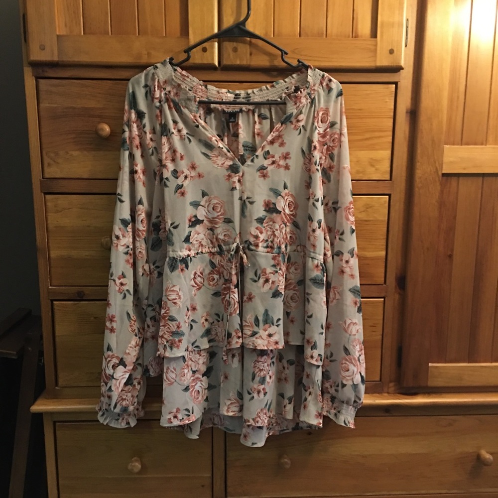 Torrid!  Beautiful tan/flowered print blouse.